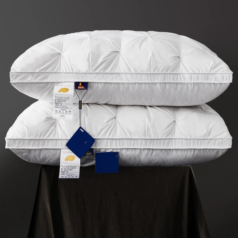Goose Pillow set displayed on a dark table, showcasing premium ergonomic design and elegant stitching.